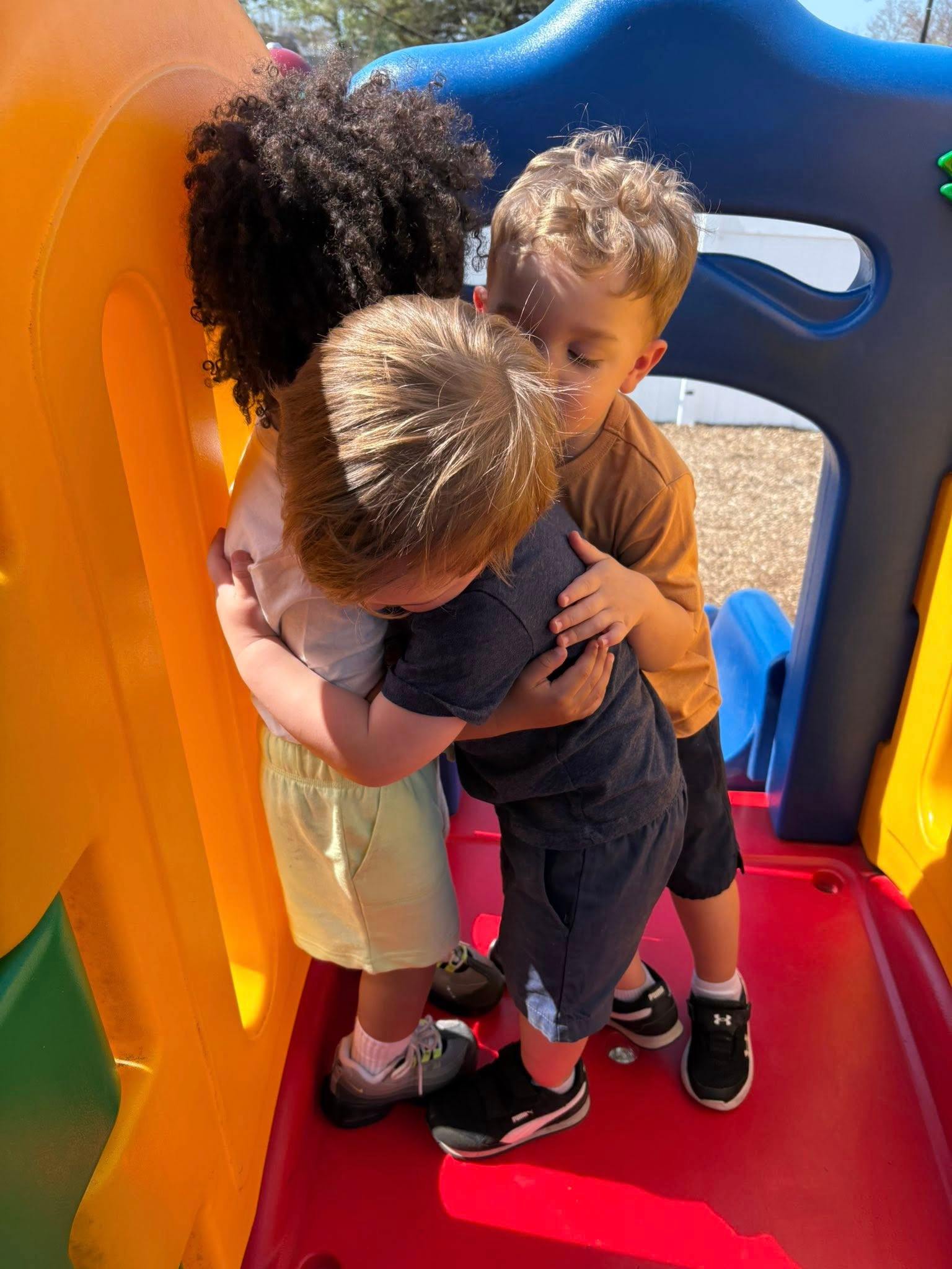 Children hugging at Rachael's Kids Care